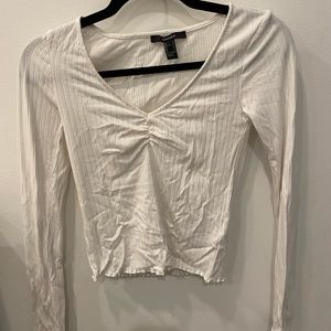 Essential white long sleeve tee for layering, going out, bars, date night